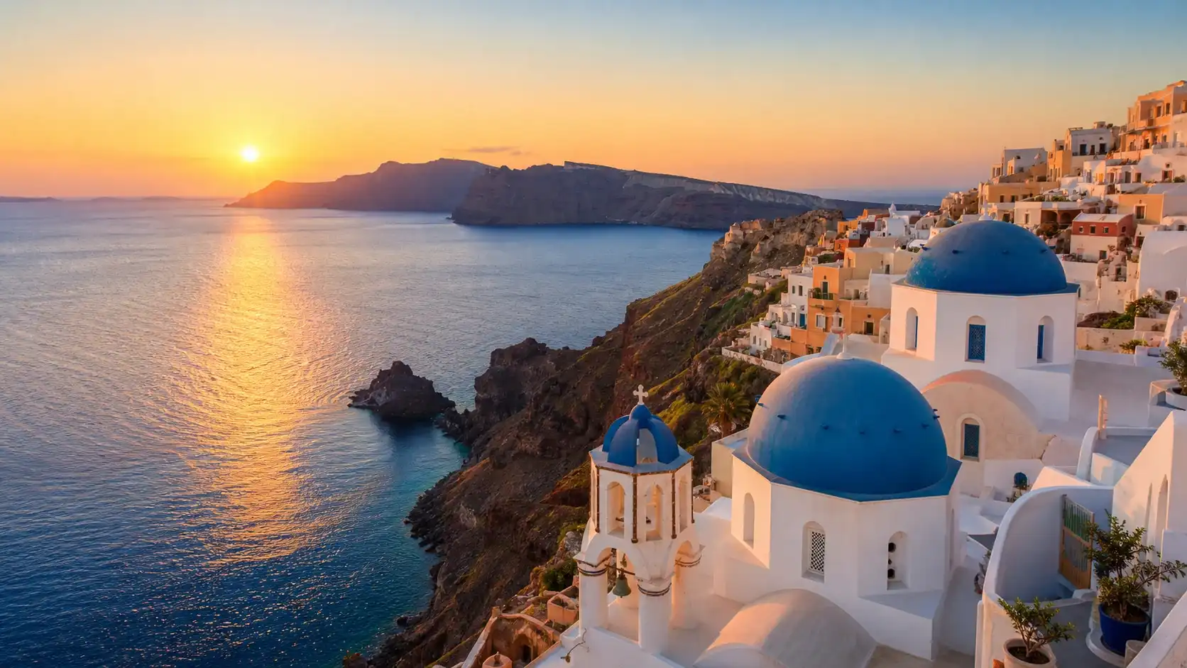 Santorini caldera view with whitewashed Cycladic buildings above the Aegean Sea