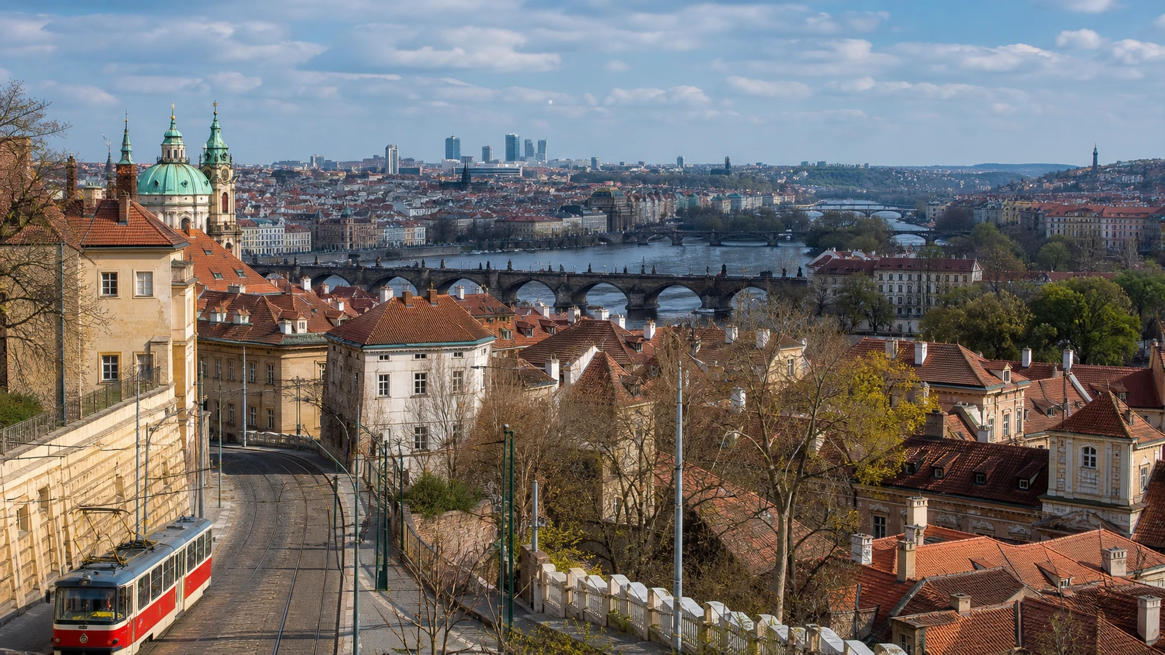 Prague rooftops, Charles Bridge, the Vltava River, and a red tram from the castle hill