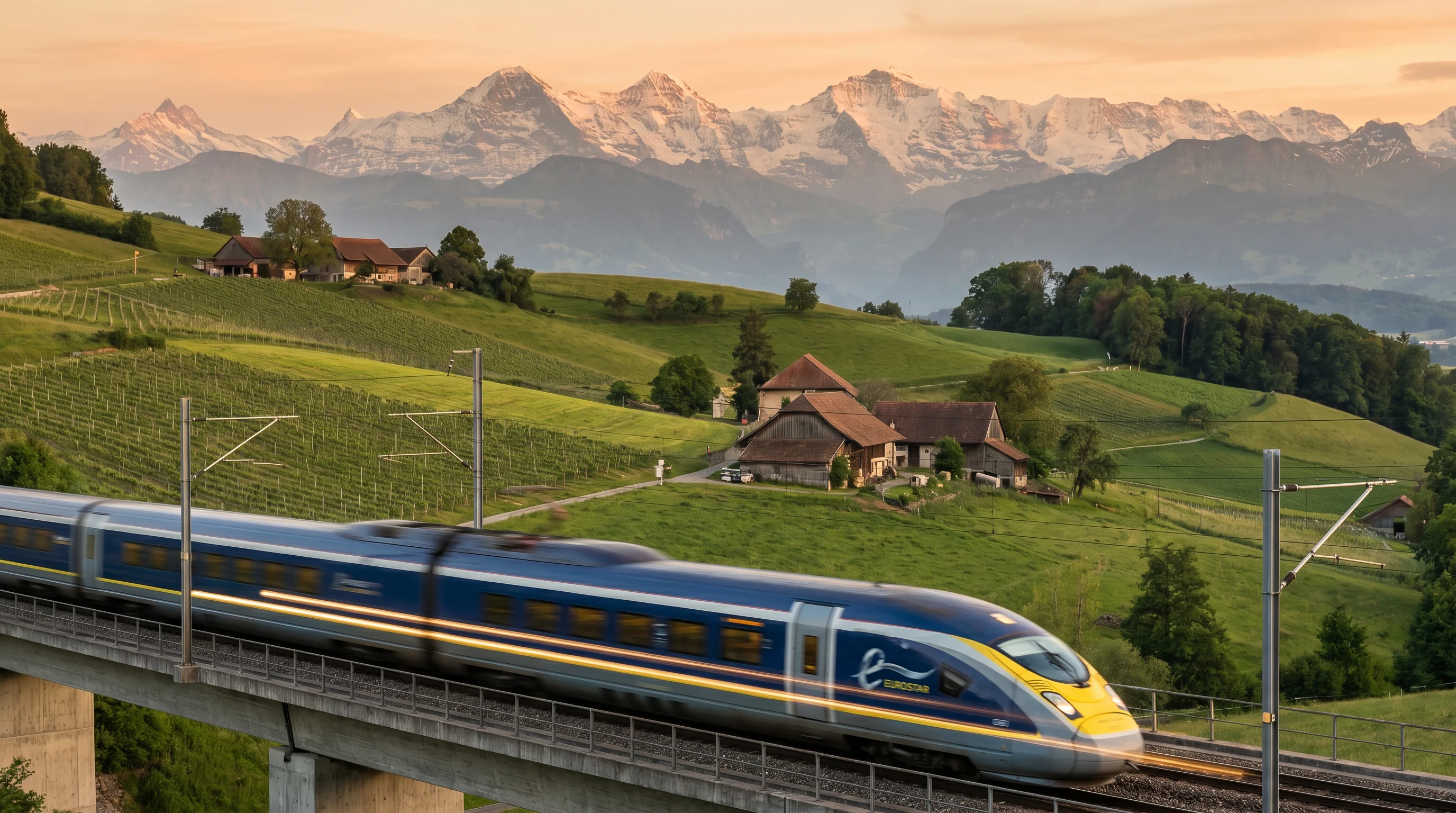 High-speed Eurostar train passing through Alpine countryside at sunset