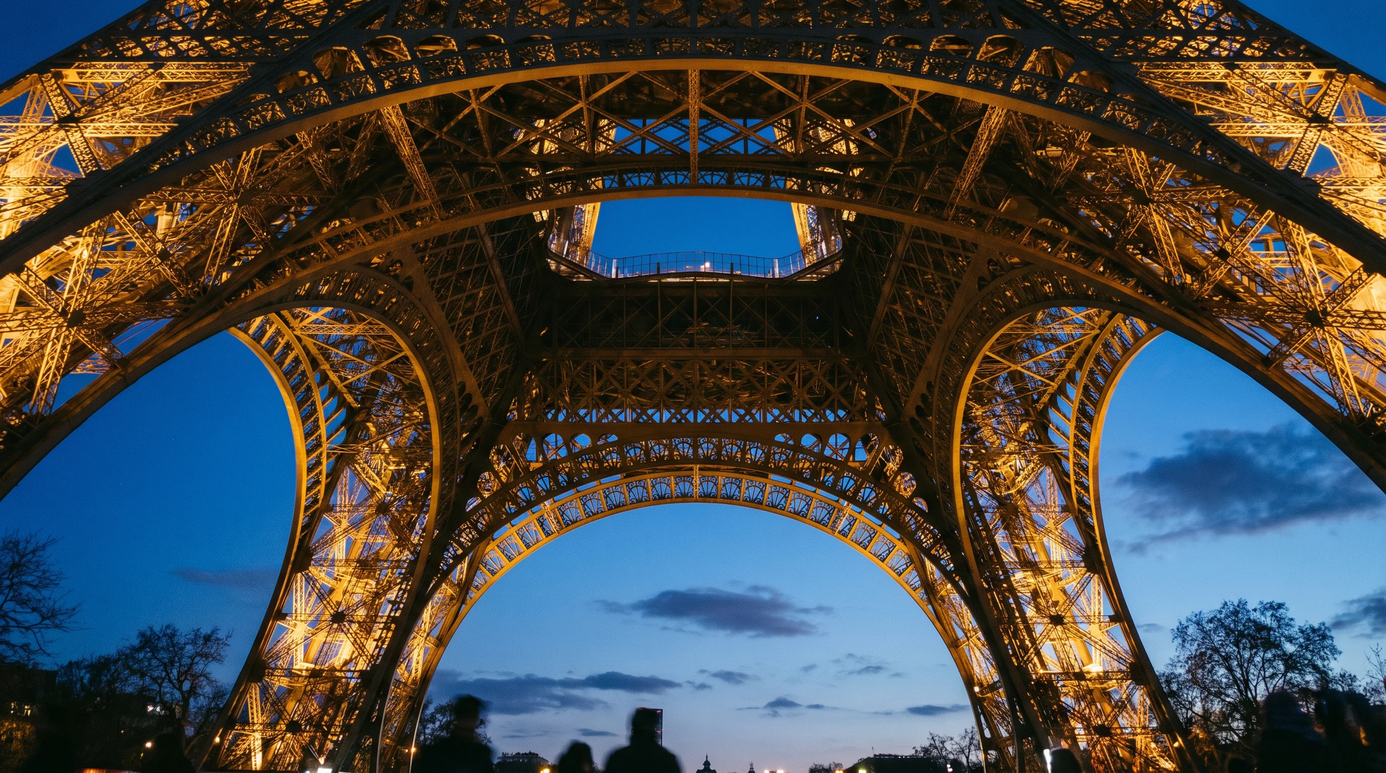 Eiffel Tower from below at dusk, Paris France